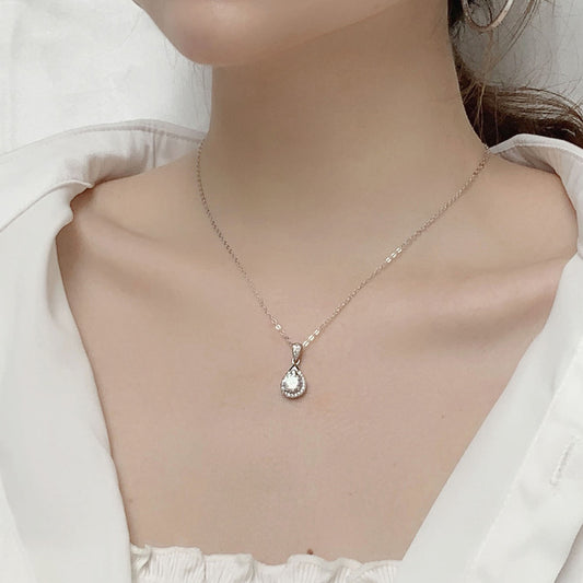 Model wearing the delicate moissanite waterdrop pendant necklace for a minimal, elegant look.