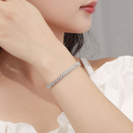 Model wearing sterling-silver wheat-link CZ bracelet