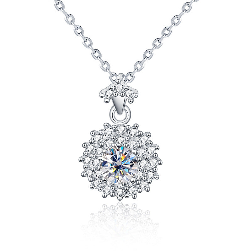 Studio image of sterling silver moissanite sunshine halo pendant with CZ accents.