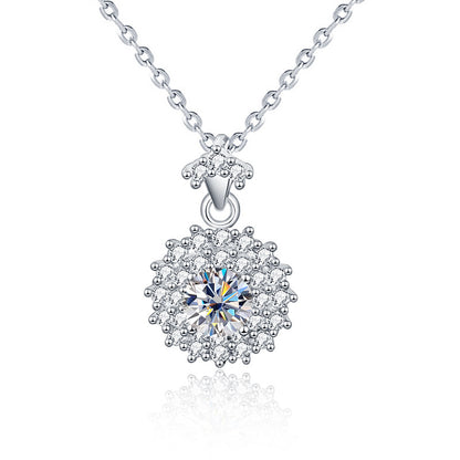 Studio image of sterling silver moissanite sunshine halo pendant with CZ accents.