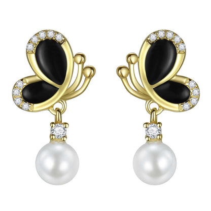 Black enamel butterfly pearl dangle earrings in 18K gold-plated 925 silver with CZ accents, front view.