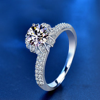 Angled view of 1 ct moissanite blossom crown ring in 925 silver with pavé CZ shoulders.