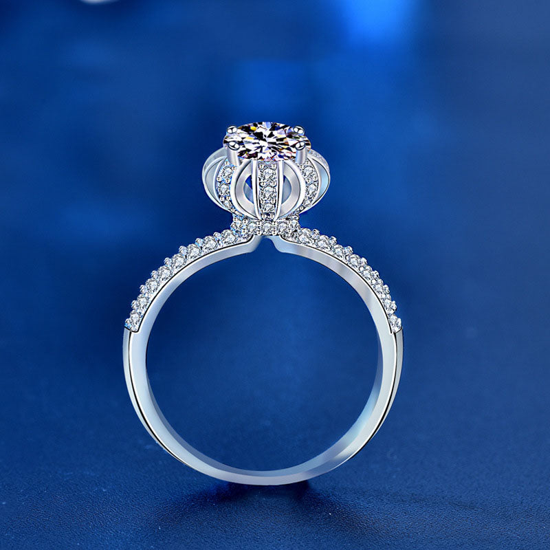Side profile showing blossom crown gallery and pavé band on 1 ct moissanite ring.