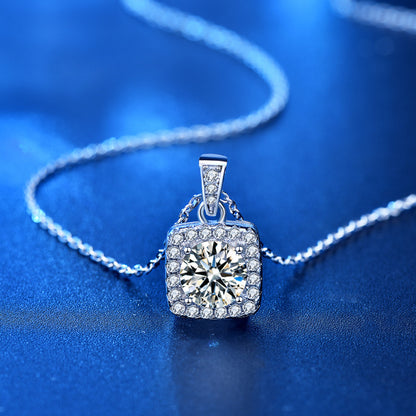 Moissanite square halo pendant with chain on blue surface, sparkling CZ halo.