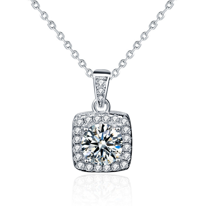 Front view of sterling silver moissanite square halo pendant necklace on white background.