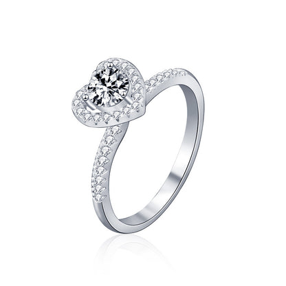 Studio product image of heart halo moissanite engagement ring in rhodium-plated sterling silver.