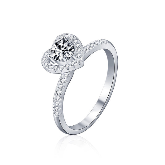 Studio product image of heart halo moissanite engagement ring in rhodium-plated sterling silver.