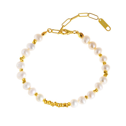 Studio image of adjustable baroque pearl bracelet in gold finish on white background