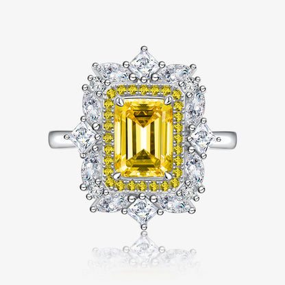 Front-facing product image of yellow baguette-cut CZ ring with floral halo in sterling silver.