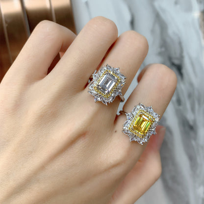 Close view of fingers styled with yellow and white baguette-cut CZ halo flower rings.