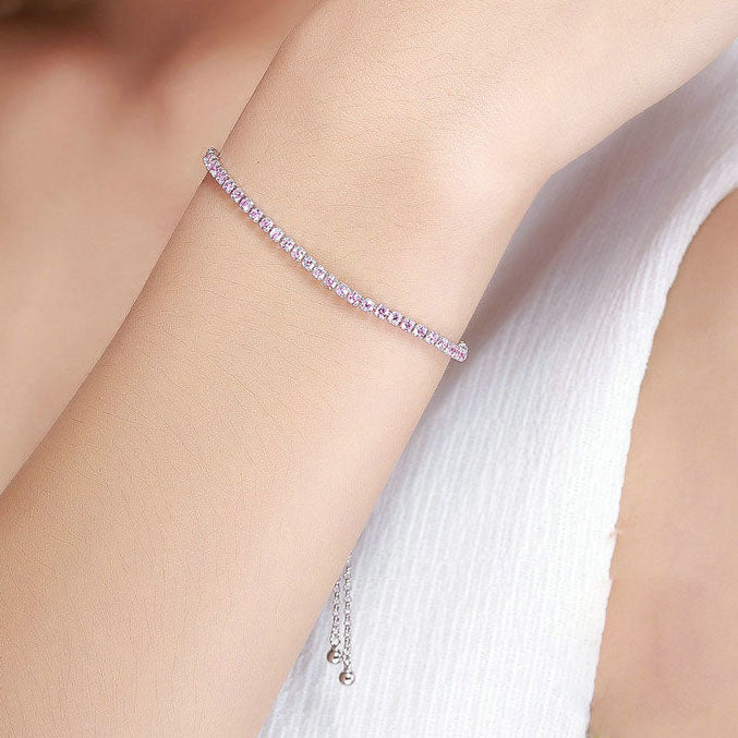  Pink CZ tennis bracelet worn on wrist with slider chain
