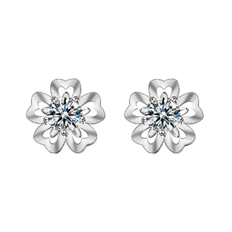 White-background render of cherry-blossom moissanite stud earrings in 925 sterling silver.