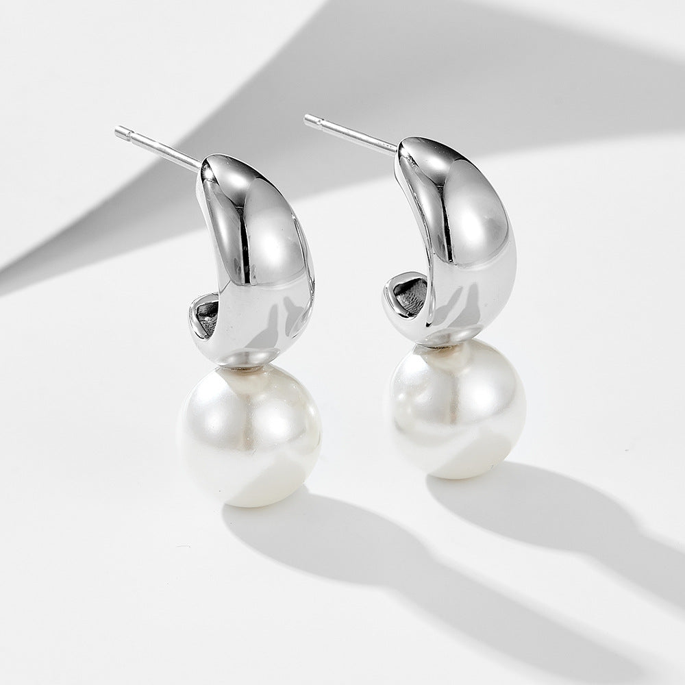 Rhodium-plated sterling silver C-hoop created pearl dangle earrings — close-up.