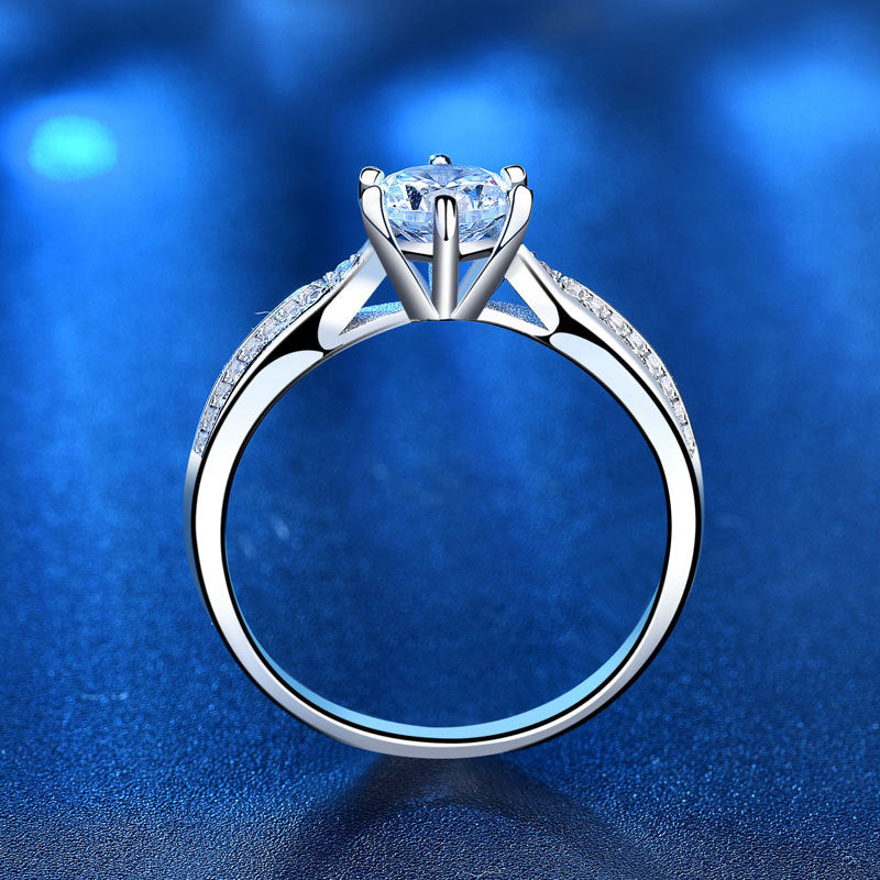 Profile showing gallery and under-setting of six-prong moissanite ring with pavé CZ shoulders