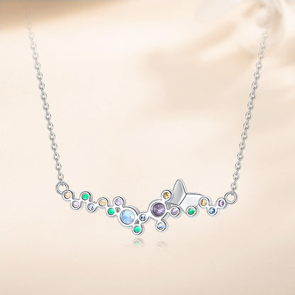 Reverse view of sterling silver butterfly necklace with smooth finish and colorful stones