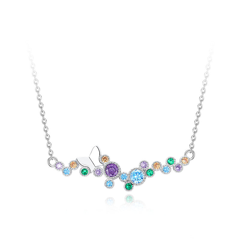 Sterling silver butterfly necklace with rainbow CZ bubble design on a white background.