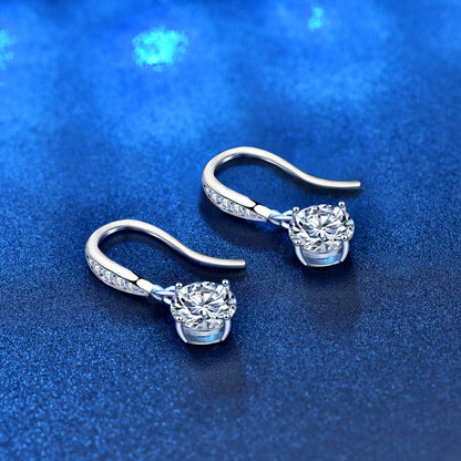Angled side view showing CZ-pavé ear wires and round moissanite dangles in sterling silver