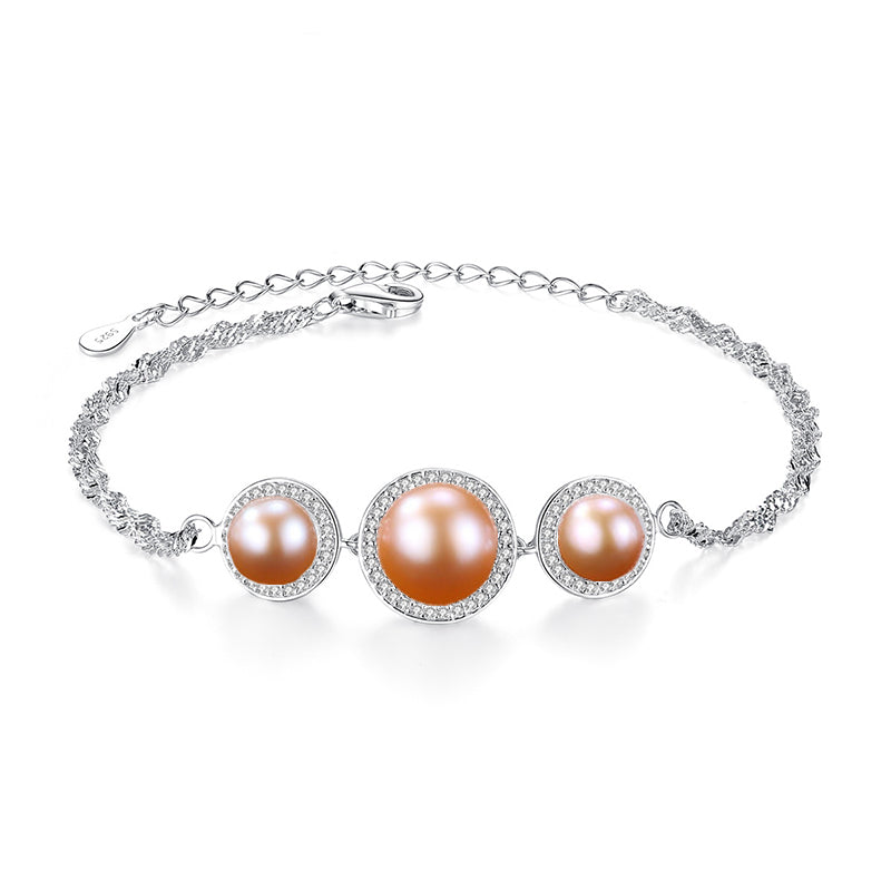 Pink cultured-pearl bracelet with CZ halo on white background.