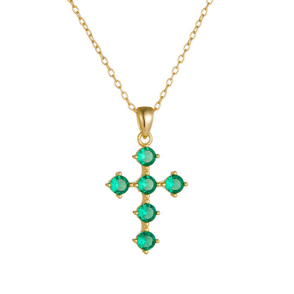 Front view of gold green CZ cross pendant necklace on chain
