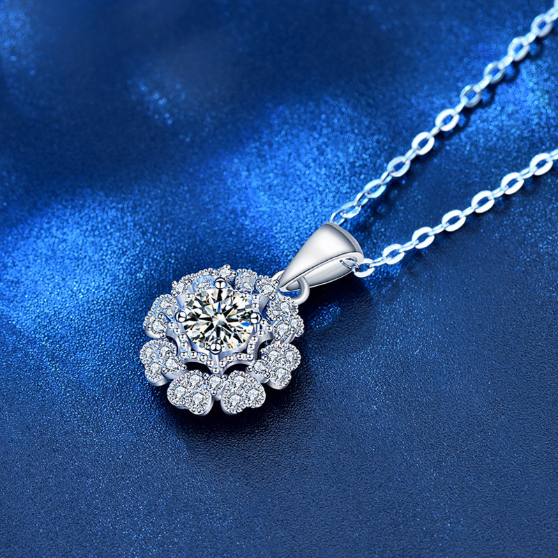 Side view close-up of floral Moissanite pendant necklace highlighting sparkle and craftsmanship