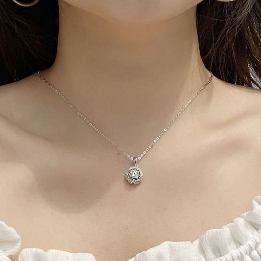 Elegant woman wearing Moissanite flower pendant necklace, demonstrating refined style