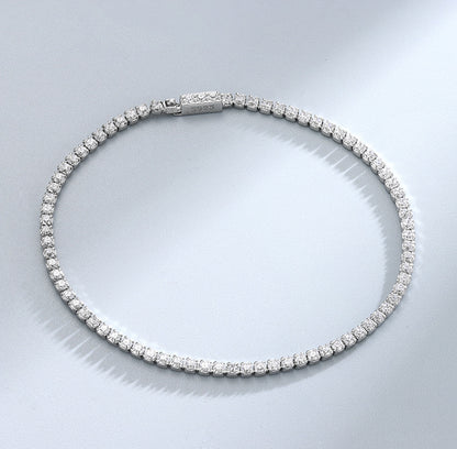 Closed circle view of sterling-silver round CZ tennis bracelet with secure clasp
