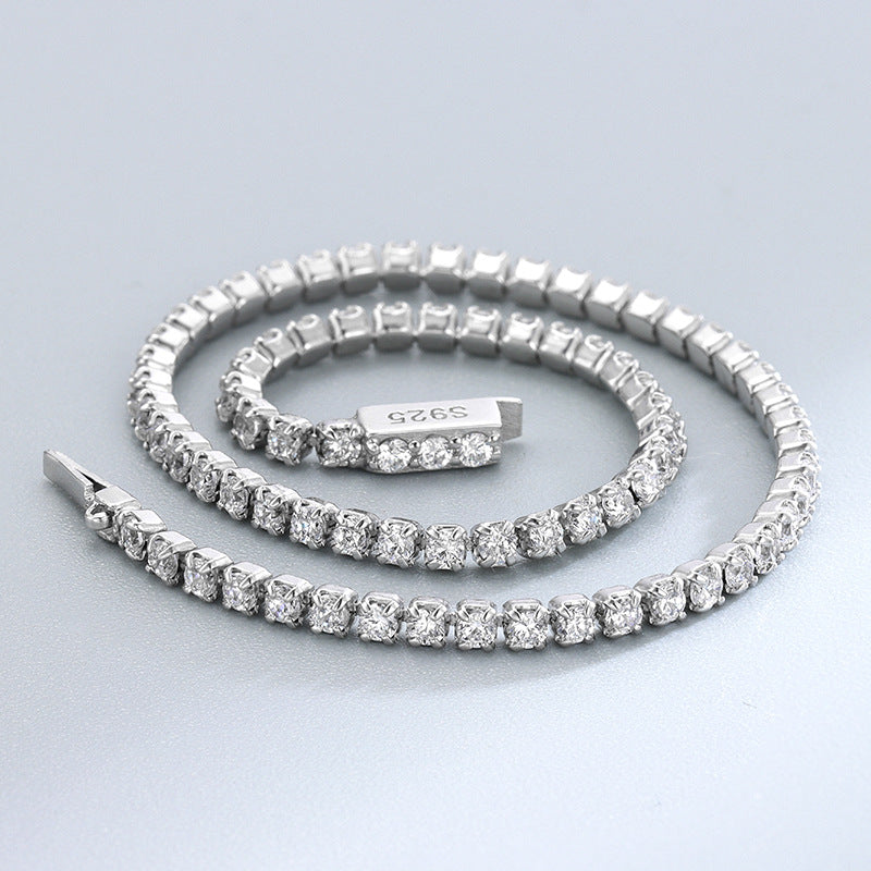 Close-up of coiled round CZ tennis bracelet with 925 stamp visible