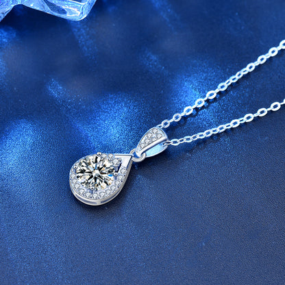 Angled side view highlighting the depth and halo of the sterling silver waterdrop pendant.