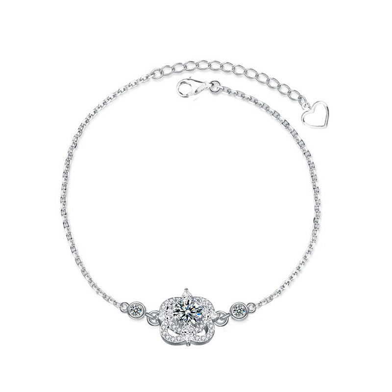 Studio image of four-leaf clover bracelet with moissanite and CZ accents in 925 sterling silver