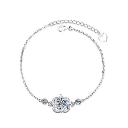 Studio image of four-leaf clover bracelet with moissanite and CZ accents in 925 sterling silver