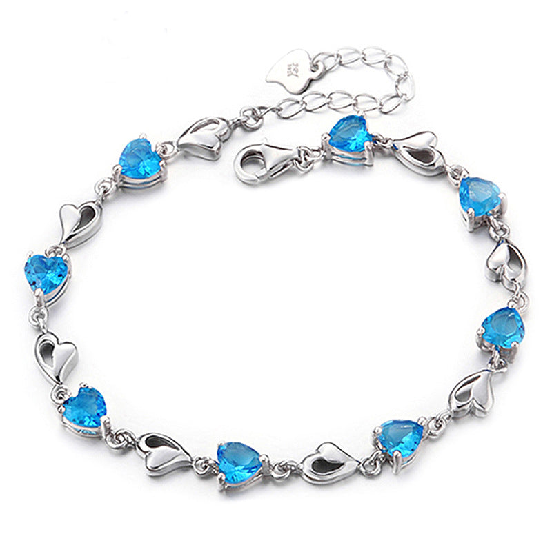 Blue heart-cut CZ bracelet in rhodium-plated 925 sterling silver with heart links and lobster clasp