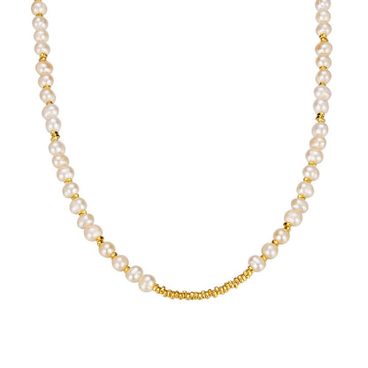 Irregular natural pearl necklace with 18K yellow gold spacer beads on white background