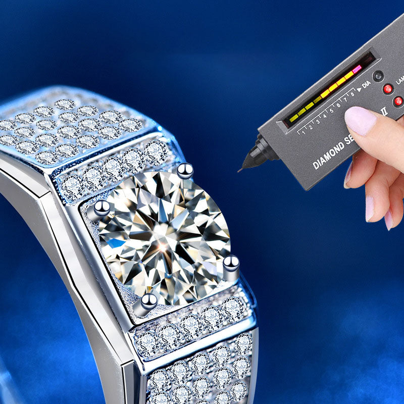 Diamond tester touching moissanite center stone on men’s silver ring