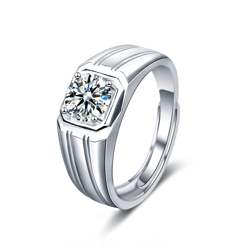 Cutout of men’s 1 ct moissanite signet ring with octagonal bezel and grooved band in rhodium-plated 925 silver on white.