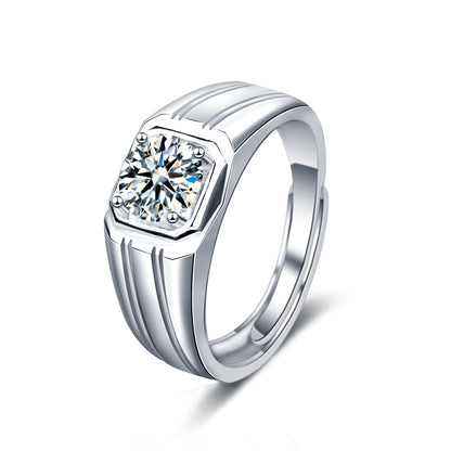 Cutout of men’s 1 ct moissanite signet ring with octagonal bezel and grooved band in rhodium-plated 925 silver on white.