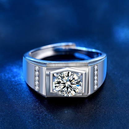 Front view of men’s ring with four-prong round moissanite and CZ channel sides in sterling silver.