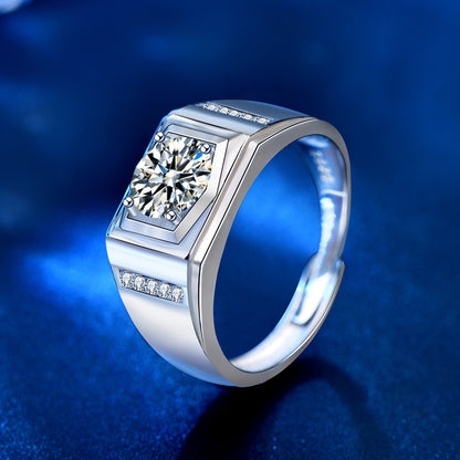 Side angle showing round moissanite held by four prongs, stepped bezel and CZ accents.