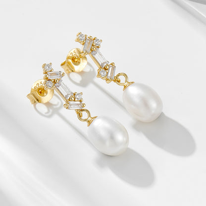Gold-finish natural pearl dangle earrings with baguette CZ