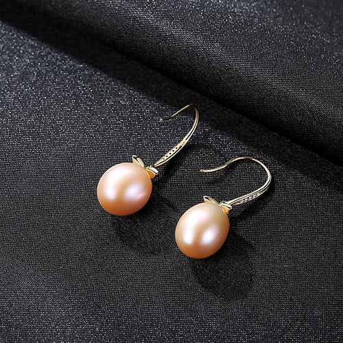 Close-up of a pink natural pearl leaf dangle earring in rhodium-plated sterling silver variant.