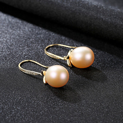 Pink natural pearl leaf dangle earrings in rhodium-plated sterling silver variant – angled view.