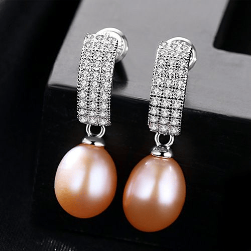 Pink freshwater pearl dangle earrings with pavé-CZ huggies in sterling silver.