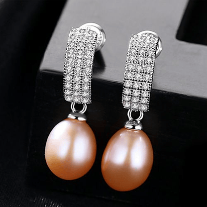 Pink freshwater pearl dangle earrings with pavé-CZ huggies in sterling silver.