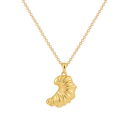 Product shot of gold croissant pendant necklace on a chain