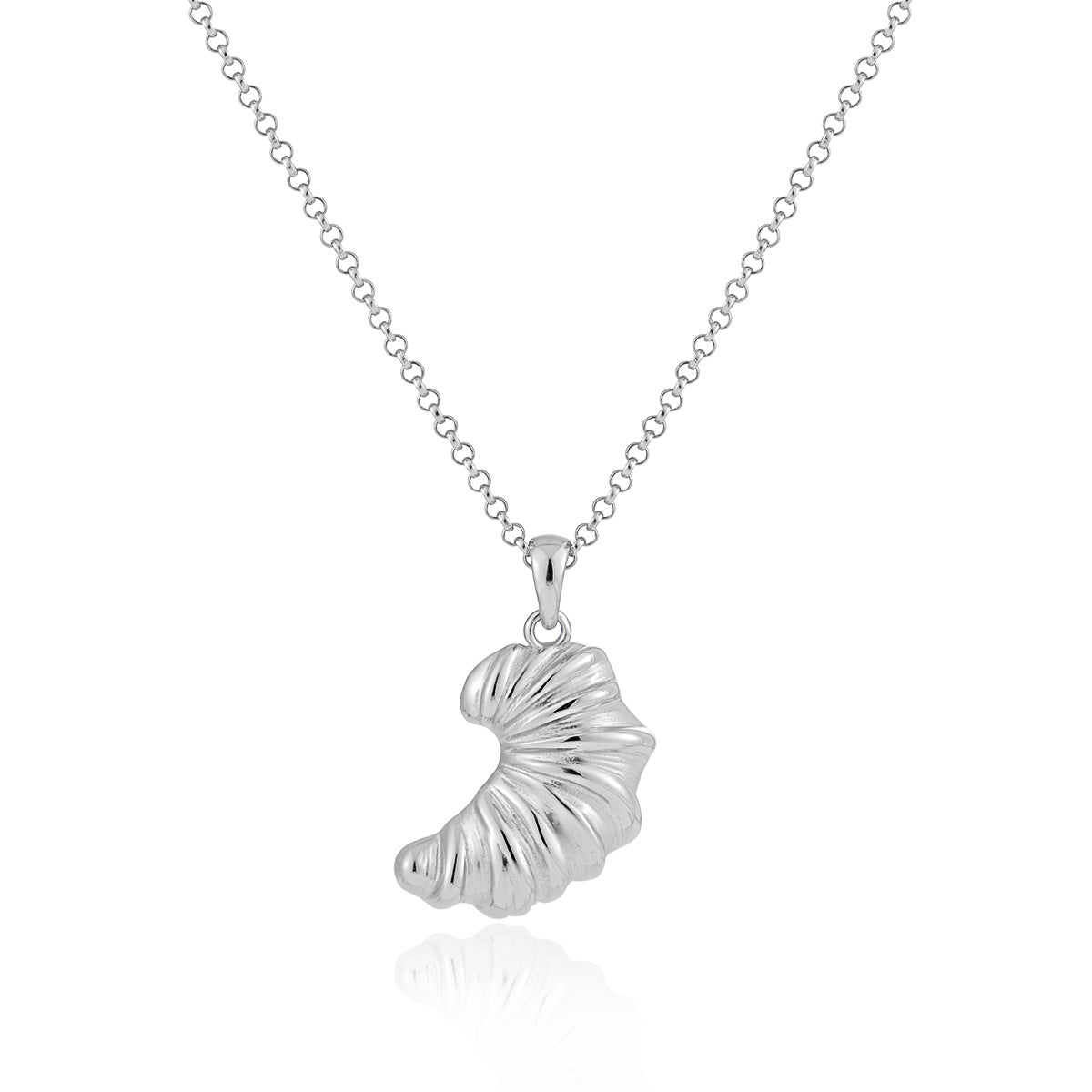 Close-up of sterling silver croissant pendant necklace on a chain
