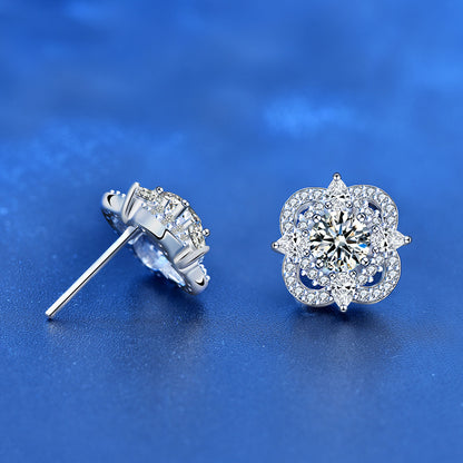 Side angle showing basket setting of quatrefoil moissanite stud in rhodium-plated 925 silver