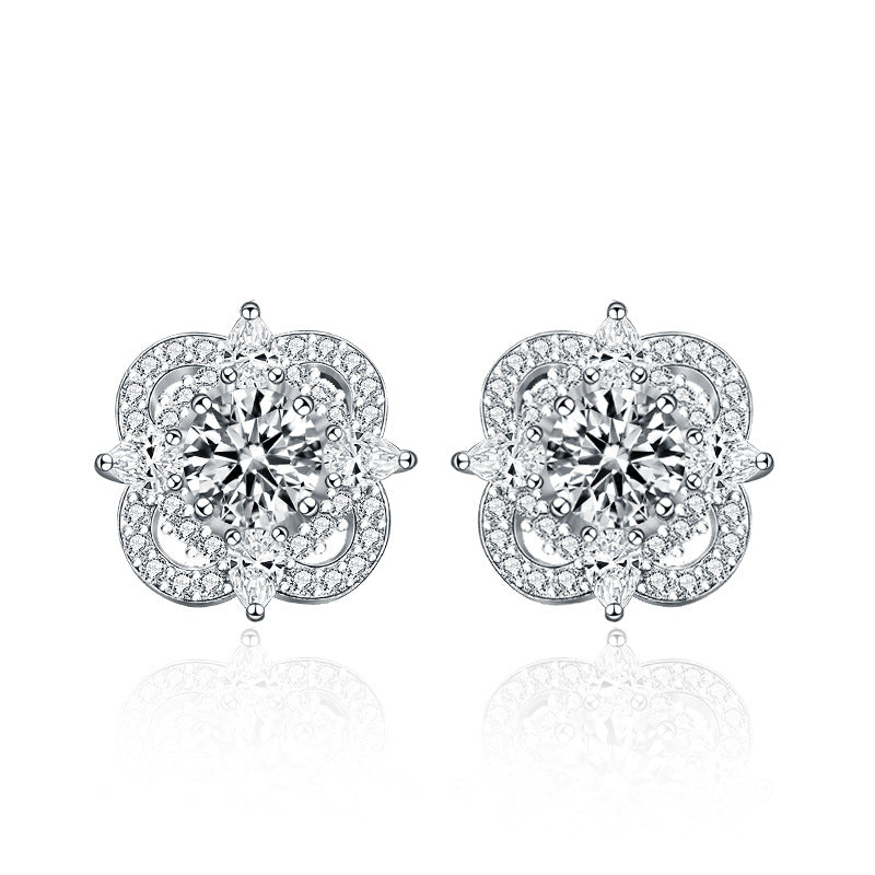 White background studio shot of quatrefoil moissanite stud earrings in 925 sterling silver