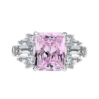 Front view of pink radiant-cut CZ cocktail ring with tapered baguette and round accents in rhodium-plated 925 silver.