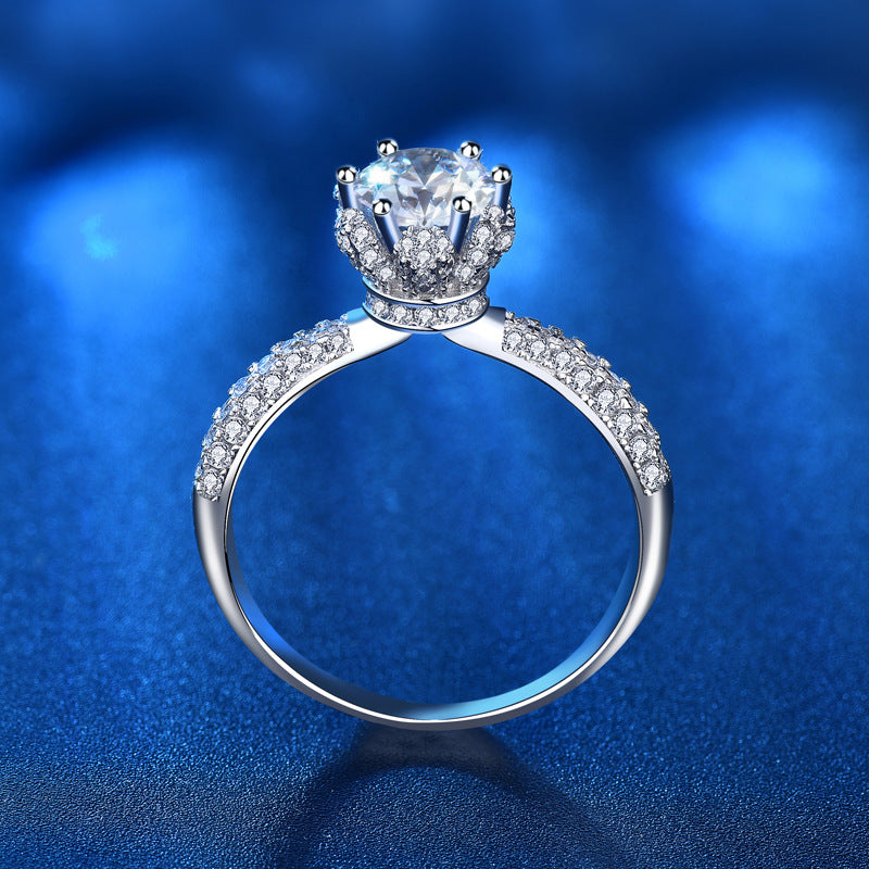Rear angle of moissanite crown ring revealing detailed basket design and full pavé band in 925 sterling silver.