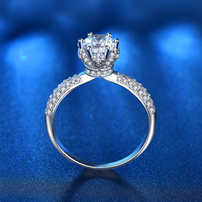 Rear angle of moissanite crown ring revealing detailed basket design and full pavé band in 925 sterling silver.