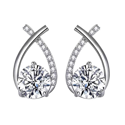 White-background packshot of ribbon-twist moissanite stud earrings in rhodium-plated 925 sterling silver with pavé CZ